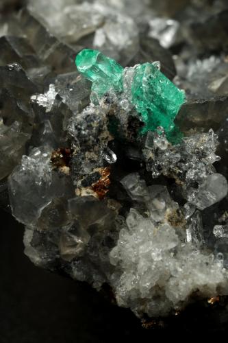 Beryl (variety emerald), Calcite, Dolomite, Pyrite, Quartz<br />La Pita mining district, Cunas Mine, Municipio Maripí, Western Emerald Belt, Boyacá Department, Colombia<br />66x49x24mm, main xl=6x4mm<br /> (Author: Fiebre Verde)