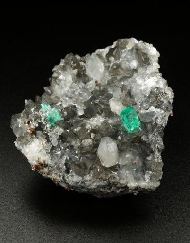 Beryl (variety emerald), Calcite, Dolomite, Pyrite, Quartz<br />La Pita mining district, Cunas Mine, Municipio Maripí, Western Emerald Belt, Boyacá Department, Colombia<br />66x49x24mm, main xl=6x4mm<br /> (Author: Fiebre Verde)