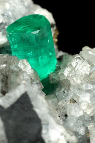 Beryl (variety emerald), Calcite, Dolomite, Pyrite<br />La Pita mining district, Polveros Mine, Municipio Maripí, Western Emerald Belt, Boyacá Department, Colombia<br />27x30x33mm, xl=9x6mm<br /> (Author: Fiebre Verde)