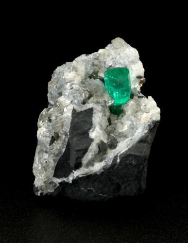 Beryl (variety emerald), Calcite, Dolomite, Pyrite<br />La Pita mining district, Polveros Mine, Municipio Maripí, Western Emerald Belt, Boyacá Department, Colombia<br />27x30x33mm, xl=9x6mm<br /> (Author: Fiebre Verde)