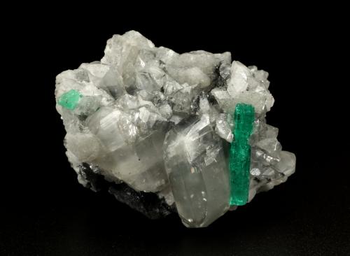 Beryl (variety emerald), Calcite, Dolomite<br />La Pita mining district, Municipio Maripí, Western Emerald Belt, Boyacá Department, Colombia<br />55x40x35mm, xl=22mm<br /> (Author: Fiebre Verde)