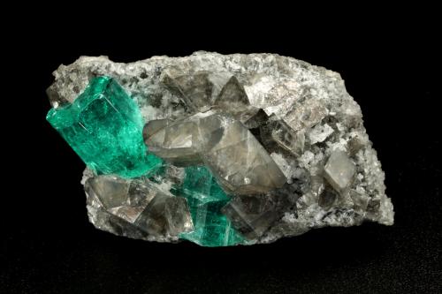 Beryl (variety emerald), Albite (variety cleavelandite), Dolomite<br />La Pita mining district, Cunas Mine, Municipio Maripí, Western Emerald Belt, Boyacá Department, Colombia<br />35x21x16mm, main xl=11x8mm<br /> (Author: Fiebre Verde)