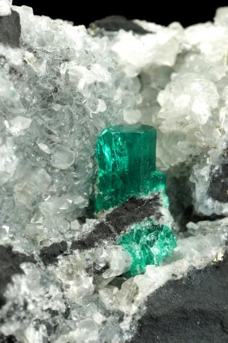 Beryl (variety emerald), Calcite, Pyrite<br />Coscuez (distrito minero), Municipio San Pablo de Borbur, Cinturón Esmeraldífero Occidental, Departamento Boyacá, Colombia<br />70x65x43mm, xl=12mm<br /> (Author: Fiebre Verde)
