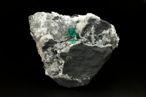 Beryl (variety emerald), Calcite, Pyrite<br />Coscuez mining district, Municipio San Pablo de Borbur, Western Emerald Belt, Boyacá Department, Colombia<br />70x65x43mm, xl=12mm<br /> (Author: Fiebre Verde)