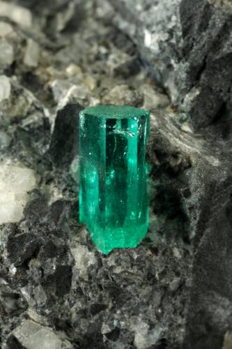 Beryl (variety emerald), Calcite, Pyrite<br />La Pita mining district, Municipio Maripí, Western Emerald Belt, Boyacá Department, Colombia<br />38x63x65mm, xl=10mm<br /> (Author: Fiebre Verde)