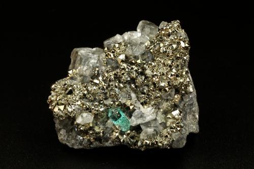 Beryl (variety emerald), Calcite, Pyrite<br />Chivor mining district, El Acuario Mine, Municipio Chivor, Eastern Emerald Belt, Boyacá Department, Colombia<br />33x41x21mm, xl=8mm<br /> (Author: Fiebre Verde)