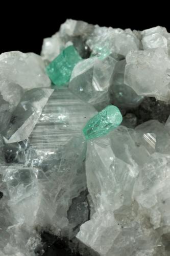 Beryl (variety emerald), Calcite<br />La Pita mining district, Municipio Maripí, Western Emerald Belt, Boyacá Department, Colombia<br />49x44x36mm, xls=6 & 4mm<br /> (Author: Fiebre Verde)