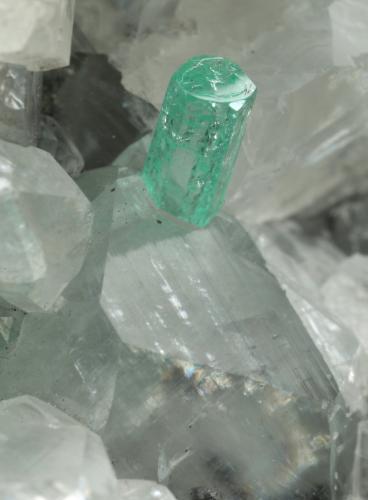 Beryl (variety emerald), Calcite<br />La Pita mining district, Municipio Maripí, Western Emerald Belt, Boyacá Department, Colombia<br />49x44x36mm, xls=6 & 4mm<br /> (Author: Fiebre Verde)