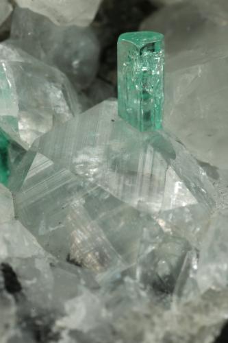 Beryl (variety emerald), Calcite<br />La Pita mining district, Municipio Maripí, Western Emerald Belt, Boyacá Department, Colombia<br />49x44x36mm, xls=6 & 4mm<br /> (Author: Fiebre Verde)