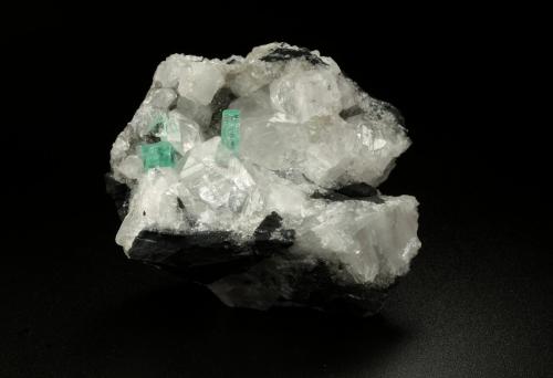 Beryl (variety emerald), Calcite<br />La Pita mining district, Municipio Maripí, Western Emerald Belt, Boyacá Department, Colombia<br />49x44x36mm, xls=6 & 4mm<br /> (Author: Fiebre Verde)