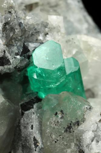 Beryl (variety emerald), Calcite, Pyrite<br />Muzo mining district, Western Emerald Belt, Boyacá Department, Colombia<br />65x90x85mm, aggregate=14x9mm<br /> (Author: Fiebre Verde)