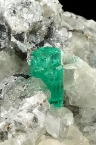 Beryl (variety emerald), Calcite, Pyrite<br />Muzo mining district, Western Emerald Belt, Boyacá Department, Colombia<br />65x90x85mm, aggregate=14x9mm<br /> (Author: Fiebre Verde)