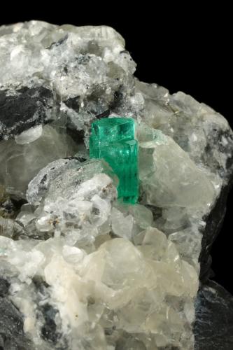 Beryl (variety emerald), Calcite, Pyrite<br />Muzo mining district, Western Emerald Belt, Boyacá Department, Colombia<br />65x90x85mm, aggregate=14x9mm<br /> (Author: Fiebre Verde)