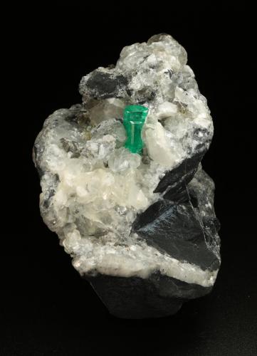 Beryl (variety emerald), Calcite, Pyrite<br />Muzo (distrito minero), Cinturón Esmeraldífero Occidental, Departamento Boyacá, Colombia<br />65x90x85mm, aggregate=14x9mm<br /> (Author: Fiebre Verde)