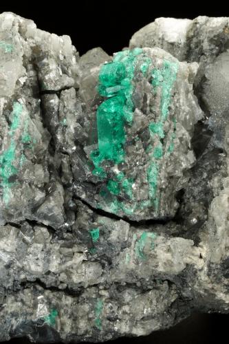 Beryl (variety emerald), Calcite, Dolomite<br />La Pita mining district, Municipio Maripí, Western Emerald Belt, Boyacá Department, Colombia<br />120x83x68mm, main xl=14mm<br /> (Author: Fiebre Verde)