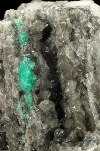 Beryl (variety emerald), Calcite, Dolomite<br />La Pita mining district, Municipio Maripí, Western Emerald Belt, Boyacá Department, Colombia<br />120x83x68mm, main xl=14mm<br /> (Author: Fiebre Verde)