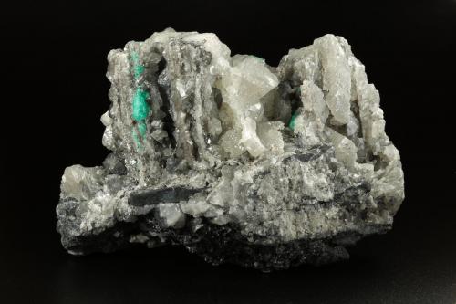 Beryl (variety emerald), Calcite, Dolomite<br />La Pita mining district, Municipio Maripí, Western Emerald Belt, Boyacá Department, Colombia<br />120x83x68mm, main xl=14mm<br /> (Author: Fiebre Verde)