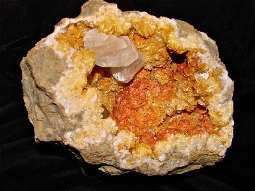 Calcites on Dolomite<br />State Route 56 road cut, Canton, Washington County, Indiana, USA<br />Geode cavity is about 17 cm, Largest calcite is 3.7 cm<br /> (Author: Bob Harman)