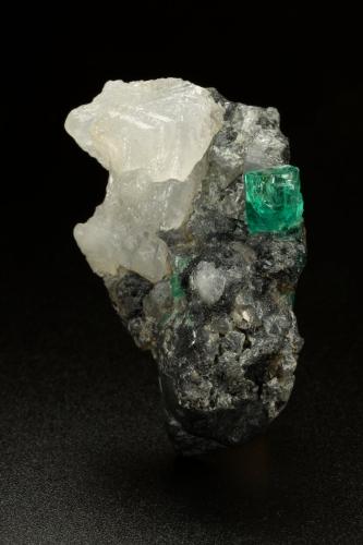 Beryl (variety emerald), Calcite, Pyrite<br />Coscuez (distrito minero), Municipio San Pablo de Borbur, Cinturón Esmeraldífero Occidental, Departamento Boyacá, Colombia<br />27x41x19mm, xl=7mm<br /> (Author: Fiebre Verde)