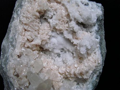 Dolomite and Calcite on Quartz<br />Subdivision retention pond construction, Monroe County, Indiana, USA<br />15 cm x 10 cm, the largest calcites are about 2 cm<br /> (Author: Bob Harman)