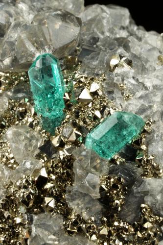 Beryl (variety emerald), Dolomite, Pyrite<br />Chivor mining district, El Acuario Mine, Municipio Chivor, Eastern Emerald Belt, Boyacá Department, Colombia<br />68x66x35mm, xls up to 10mm<br /> (Author: Fiebre Verde)