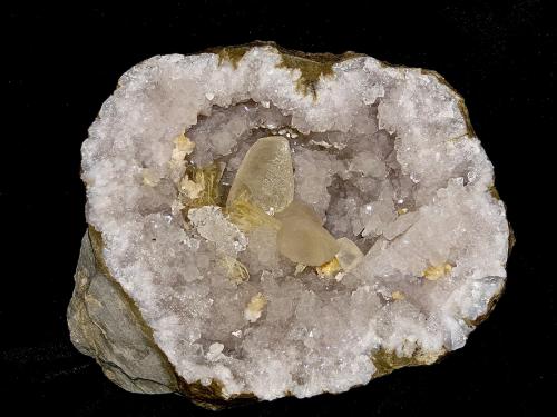 Barite and Calcite on Quartz and with Dolomite<br />Monroe Reservoir spillway, Monroe County, Indiana, USA<br />geode cavity is 15 x 13 cm largest calcite is about 5 cm and the barites are about 2.5 cm<br /> (Author: Bob Harman)