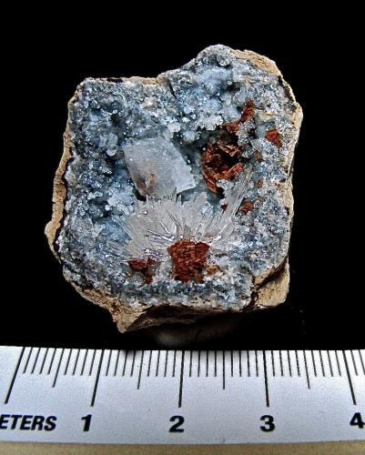 Calcite, Aragonite and Dolomite (variety ferroan) on Quartz<br />Keokuk, Lee County, Iowa, USA<br />geode is about 3.3 cm, calcite is 0.7 cm, aragonite spray is 1.3 cm<br /> (Author: Bob Harman)