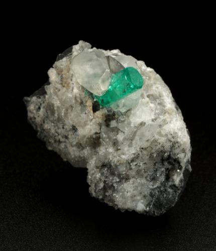 Beryl (variety emerald), Calcite, Dolomite<br />La Pita mining district, Municipio Maripí, Western Emerald Belt, Boyacá Department, Colombia<br />32x28x22mm, xl=11mm<br /> (Author: Fiebre Verde)