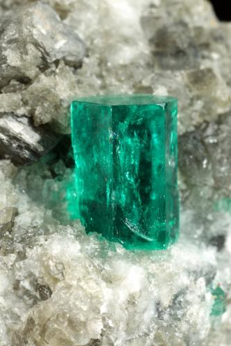 Beryl (variety emerald), Calcite, Dolomite<br />La Pita mining district, Cunas Mine, Municipio Maripí, Western Emerald Belt, Boyacá Department, Colombia<br />38x58x47mm, xl=9mm<br /> (Author: Fiebre Verde)