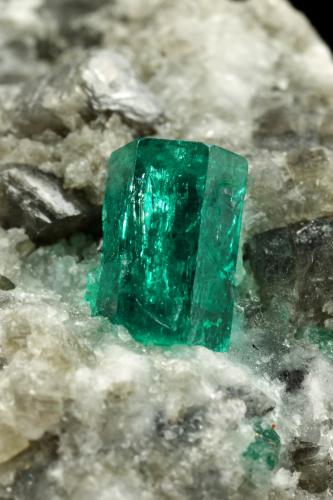 Beryl (variety emerald), Calcite, Dolomite<br />La Pita mining district, Cunas Mine, Municipio Maripí, Western Emerald Belt, Boyacá Department, Colombia<br />38x58x47mm, xl=9mm<br /> (Author: Fiebre Verde)