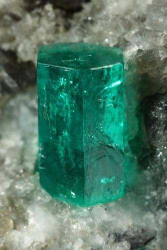 Beryl (variety emerald), Calcite, Dolomite<br />La Pita mining district, Cunas Mine, Municipio Maripí, Western Emerald Belt, Boyacá Department, Colombia<br />38x58x47mm, xl=9mm<br /> (Author: Fiebre Verde)