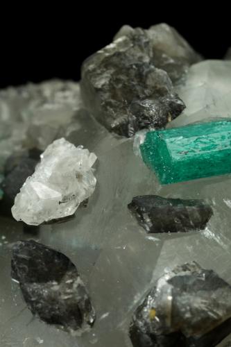 Beryl (variety emerald), Calcite, Dolomite<br />La Pita mining district, Cunas Mine, Municipio Maripí, Western Emerald Belt, Boyacá Department, Colombia<br />61x50x38mm, xls=22 & 17mm<br /> (Author: Fiebre Verde)