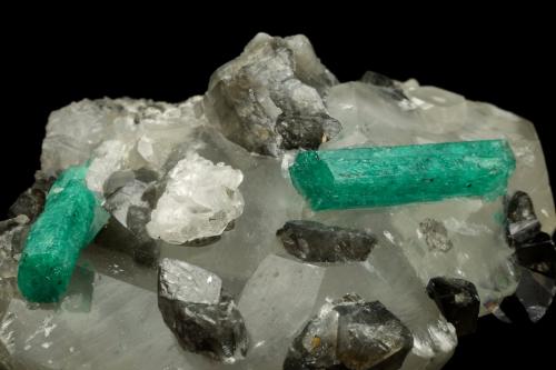 Beryl (variety emerald), Calcite, Dolomite<br />La Pita mining district, Cunas Mine, Municipio Maripí, Western Emerald Belt, Boyacá Department, Colombia<br />61x50x38mm, xls=22 & 17mm<br /> (Author: Fiebre Verde)