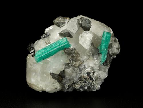 Beryl (variety emerald), Calcite, Dolomite<br />La Pita mining district, Cunas Mine, Municipio Maripí, Western Emerald Belt, Boyacá Department, Colombia<br />61x50x38mm, xls=22 & 17mm<br /> (Author: Fiebre Verde)