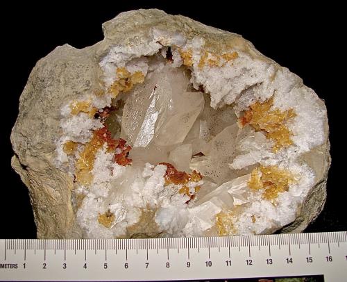 Calcite with Marcasite inclusions on Dolomite and Quartz<br />Afloramientos Carretera Estatal 37, Harrodsburg, Clear Creek, Condado Monroe, Indiana, USA<br />geode is about 14 cm,  cavity is about 10 cm, largest calcite is about 4.5 cm<br /> (Author: Bob Harman)