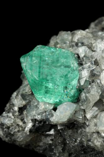 Beryl (variety emerald), Calcite, Dolomite<br />La Pita mining district, Municipio Maripí, Western Emerald Belt, Boyacá Department, Colombia<br />39x24x18mm, xl=9mm<br /> (Author: Fiebre Verde)