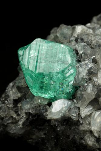 Beryl (variety emerald), Calcite, Dolomite<br />La Pita mining district, Municipio Maripí, Western Emerald Belt, Boyacá Department, Colombia<br />39x24x18mm, xl=9mm<br /> (Author: Fiebre Verde)