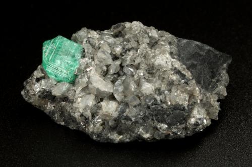 Beryl (variety emerald), Calcite, Dolomite<br />La Pita mining district, Municipio Maripí, Western Emerald Belt, Boyacá Department, Colombia<br />39x24x18mm, xl=9mm<br /> (Author: Fiebre Verde)