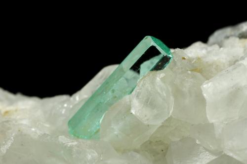 Beryl (variety emerald), Calcite<br />La Pita mining district, Municipio Maripí, Western Emerald Belt, Boyacá Department, Colombia<br />46x85x20mm, xls=26, 16 & 13mm<br /> (Author: Fiebre Verde)