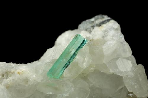 Beryl (variety emerald), Calcite<br />La Pita mining district, Municipio Maripí, Western Emerald Belt, Boyacá Department, Colombia<br />46x85x20mm, xls=26, 16 & 13mm<br /> (Author: Fiebre Verde)