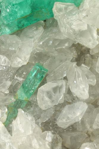 Beryl (variety emerald), Calcite<br />La Pita mining district, Municipio Maripí, Western Emerald Belt, Boyacá Department, Colombia<br />46x85x20mm, xls=26, 16 & 13mm<br /> (Author: Fiebre Verde)