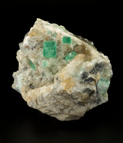 Beryl (variety emerald), Calcite, Aragonite<br />Chivor mining district, Municipio Chivor, Eastern Emerald Belt, Boyacá Department, Colombia<br />75x63x64mm, main xl=11x9mm<br /> (Author: Fiebre Verde)