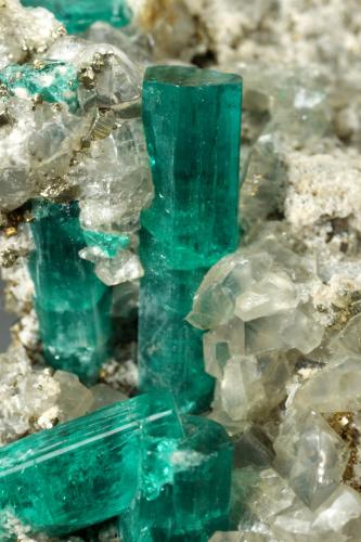 Beryl (variety emerald), Dolomite, Pyrite<br />Chivor mining district, San Gregorio Mine, Municipio Chivor, Eastern Emerald Belt, Boyacá Department, Colombia<br />21x58x31mm, largest xl=13mm<br /> (Author: Fiebre Verde)