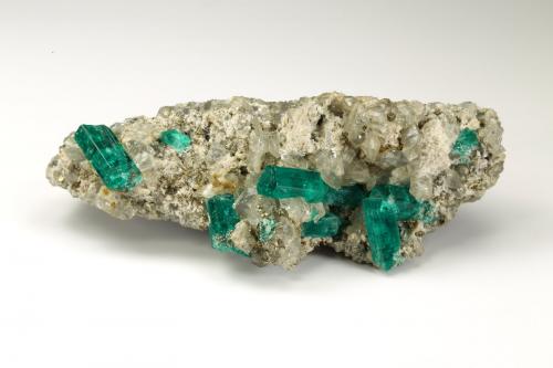 Beryl (variety emerald), Dolomite, Pyrite<br />Chivor mining district, San Gregorio Mine, Municipio Chivor, Eastern Emerald Belt, Boyacá Department, Colombia<br />21x58x31mm, largest xl=13mm<br /> (Author: Fiebre Verde)