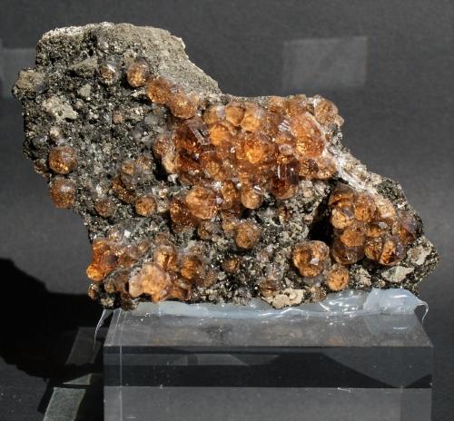 Grossular (variety hessonite)<br />Jeffrey Mine, Asbestos, Les Sources RCM, Estrie, Québec, Canada<br />80mm x 50mm 10 mm<br /> (Author: Philippe Durand)