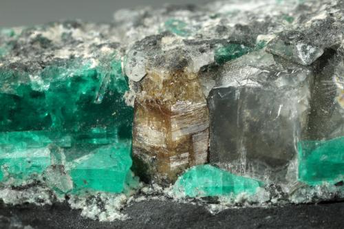 Beryl (variety emerald), Dolomite, Parisite-(Ce)<br />Muzo mining district, Western Emerald Belt, Boyacá Department, Colombia<br />39x12x22mm, Parisite=5mm, largest Beryl=12mm<br /> (Author: Fiebre Verde)