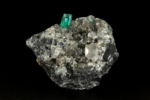 Beryl (variety emerald), Calcite, Dolomite, Pyrite<br />Coscuez mining district, Municipio San Pablo de Borbur, Western Emerald Belt, Boyacá Department, Colombia<br />70x50x55mm, aggregate=10mm<br /> (Author: Fiebre Verde)
