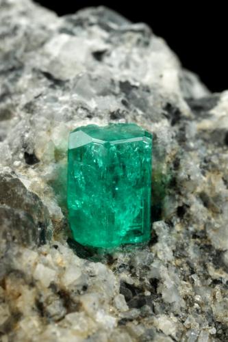 Beryl (variety emerald), Calcite<br />La Pita mining district, Cunas Mine, Municipio Maripí, Western Emerald Belt, Boyacá Department, Colombia<br />27x33x35mm, xl=9mm<br /> (Author: Fiebre Verde)