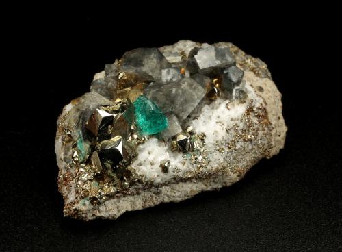 Beryl (variety emerald), Albite (variety cleavelandite), Pyrite, Calcite<br />Chivor mining district, Municipio Chivor, Eastern Emerald Belt, Boyacá Department, Colombia<br />47x16x29mm, xl=4mm<br /> (Author: Fiebre Verde)