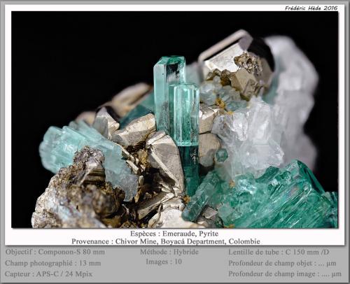 Beryl (variety emerald) with Pyrite<br />Chivor mining district, Municipio Chivor, Eastern Emerald Belt, Boyacá Department, Colombia<br />fov 12 mm<br /> (Author: ploum)